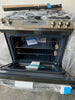 GE JGSS66SELSS 30 Inch Slide-In Gas Range with 5 Sealed Burners, 5.3 cu. ft. Oven Capacity, Storage Drawer, In-oven Broil, Steam Clean, Integrated Non-Stick Griddle, Power Boil Burners, Oval Burner, CSA Certified, and ADA Compliant: Stainless Steel