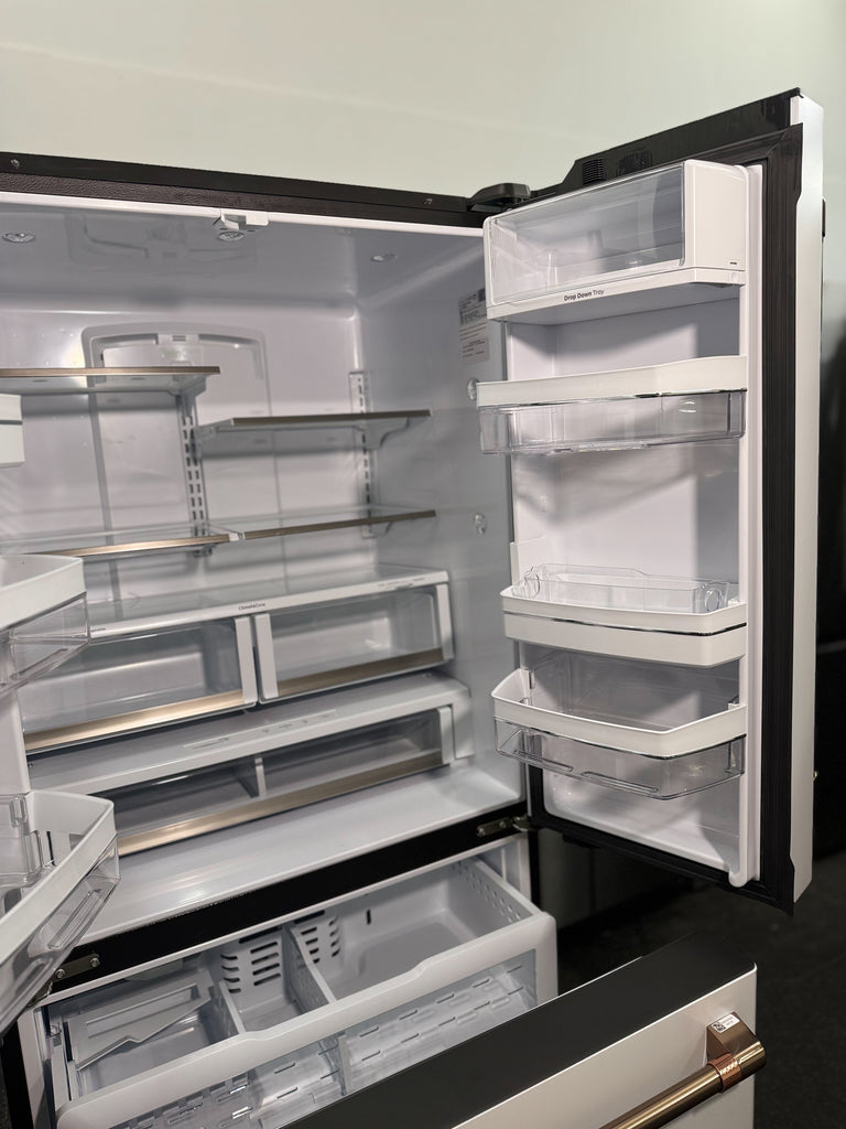 Cafe CWE23SP4MW2 36 Inch Counter Depth French Door Smart Refrigerator with 23.1 Cu. Ft. Capacity, TwinChill™ Evaporators, Temperature-Controlled Drawer, Wi-Fi, Internal Water\Ice Dispenser, and ENERGY STAR®: Matte White with Brushed Bronze Handles