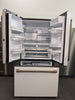 Cafe CWE23SP4MW2 36 Inch Counter Depth French Door Smart Refrigerator with 23.1 Cu. Ft. Capacity, TwinChill™ Evaporators, Temperature-Controlled Drawer, Wi-Fi, Internal Water\Ice Dispenser, and ENERGY STAR®: Matte White with Brushed Bronze Handles