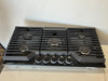Frigidaire Gallery Series GCCG3648AB 36 Inch Gas Cooktop with 5 Sealed Burners, Quick Boil Burner, Simmer Burner, Continuous Grates, Backlit LED Knobs, and ADA Compliant: Black